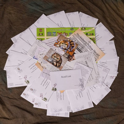 Collection of printed materials including letters and postcards on a wooden surface